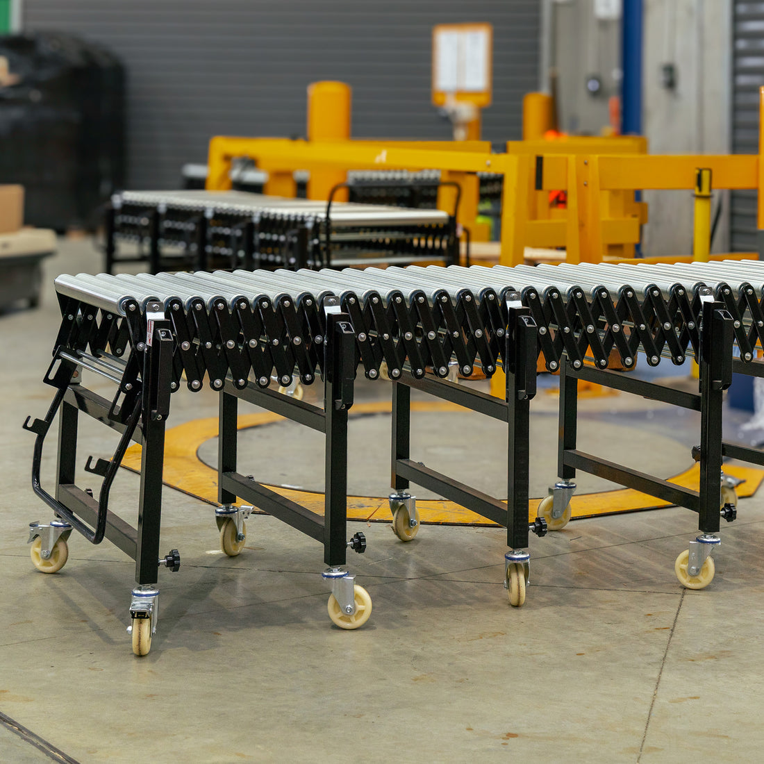 Expandable Steel Roller Conveyor 610mm W x 1.5-4.0m L - Omni Packaging 