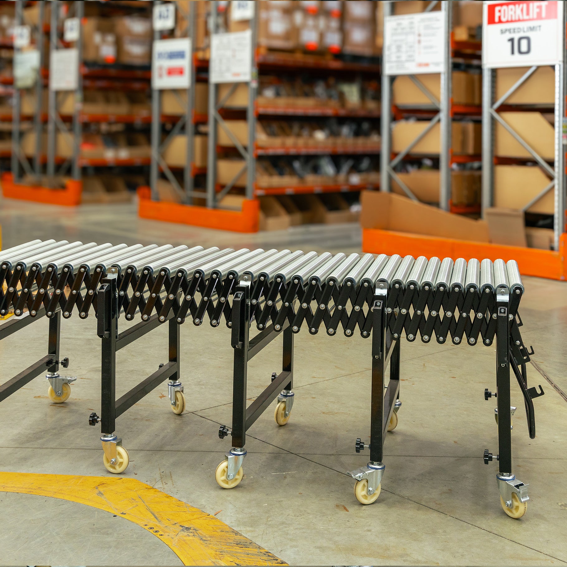 Expandable Steel Roller Conveyor 610mm W x 1.5-4.0m L - Omni Packaging 