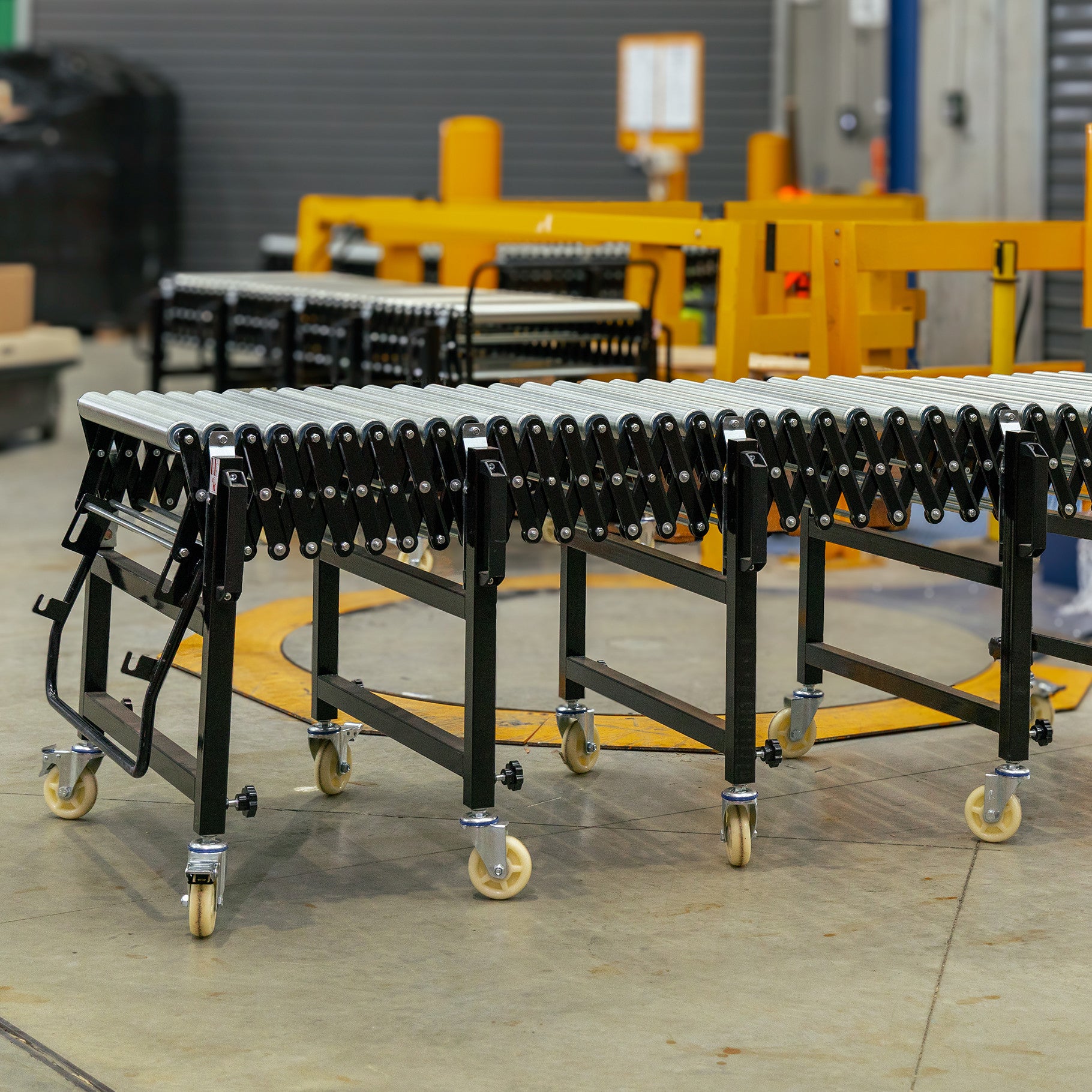 Expandable Steel Roller Conveyor 760mm W x 1.5-4.0m L - Omni Packaging 